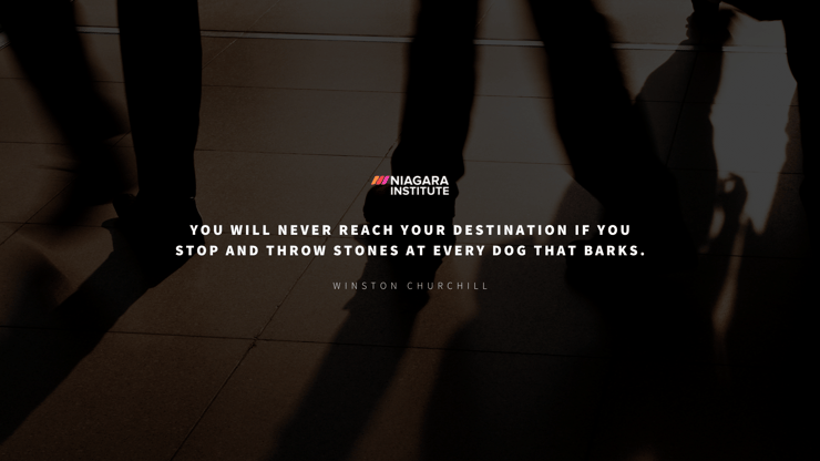 You will never reach your destination if you stop and throw stones at every dog that barks - Winston Churchill Motivational Quote for Employees